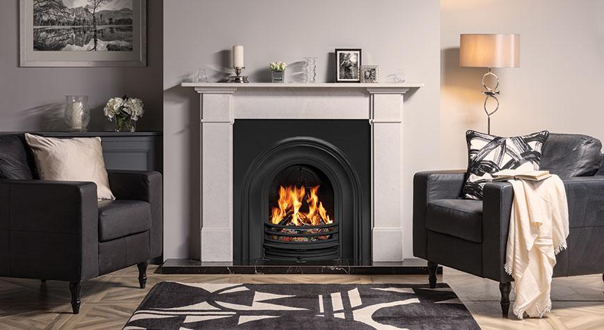 Stovax Classical Arched Insert fireplace shown with Claremont stone mantel, Matt Black