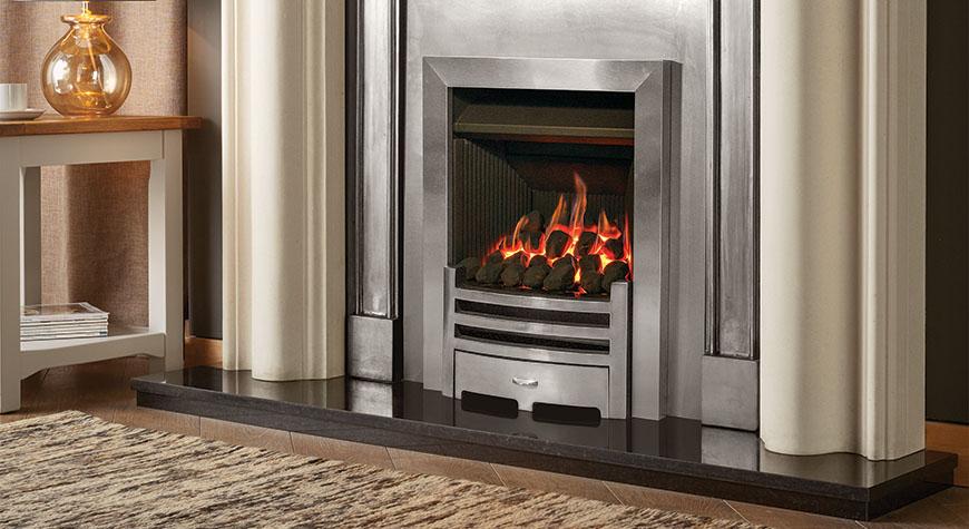 Logic Convector conventional flue fire with Highlight Polished Arts front. Shown with Grafton Limestone mantel, Polished Belgravia Cast front and Insert Panel.