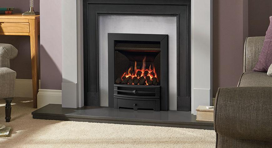 Logic Convector conventional flue fire with Matt Black Chartwell front. Shown with Grey Pembroke wooden mantel with Belgravia Matt Black Cast Front and Polished Insert Panel.
