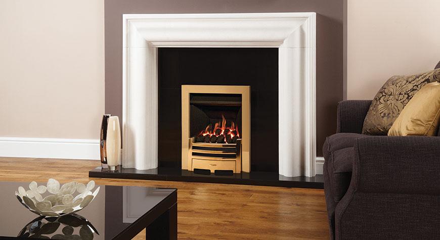 Logic Convector conventional flue fire with Polished Brass-effect Arts front. Shown with Grafton Limestone mantel.