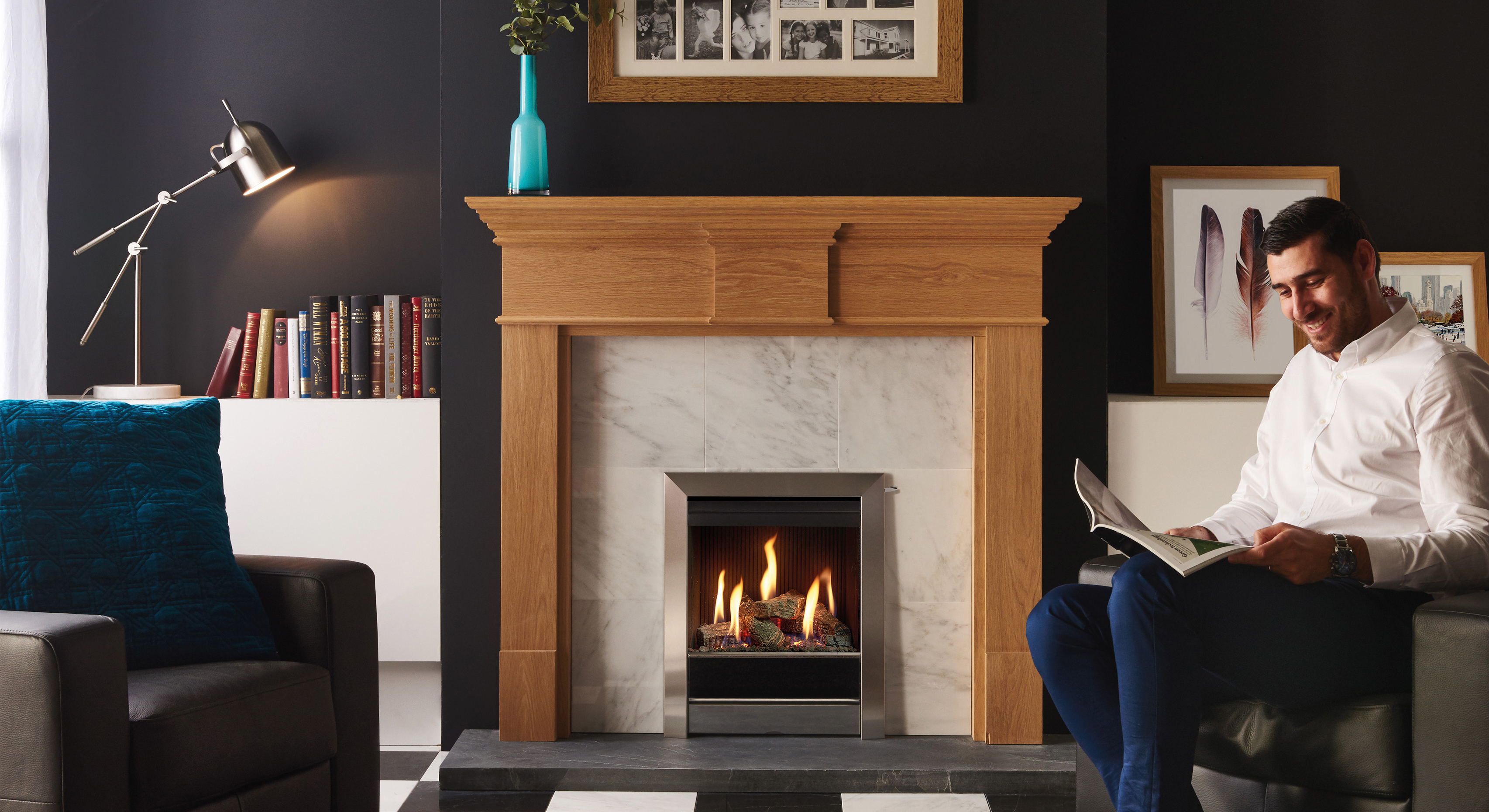 Gazco Logic™ HE Conventional flue fire with Log-effect fuel bed and Brushed Stainless Tempo front. Also shown Pembroke Roach Oak mantel from Stovax.