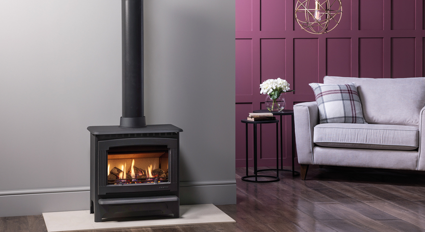 Gazco Marlborough2 gas fire freestanding stove, shown in an opulent living room inspired by Barbiecore.