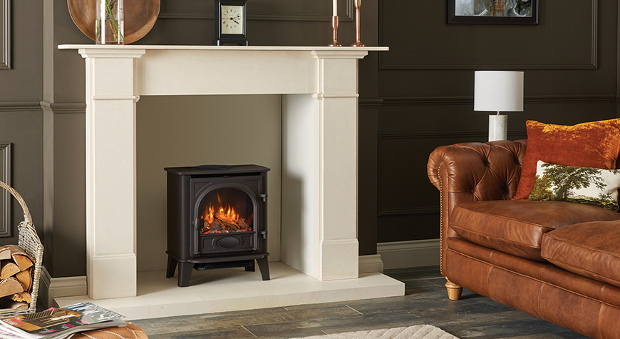 Stockton 5 Electric with Log & Pebble fuel effect and Amber flame setting.  Shown with Claremont Limestone mantel