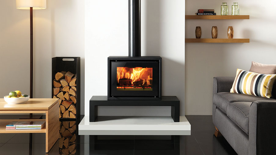 Stovax Studio 500 Freestanding wood burning stove on a 100 Low Riva Bench. Also shown: Medium log holder  also available from Stovax.