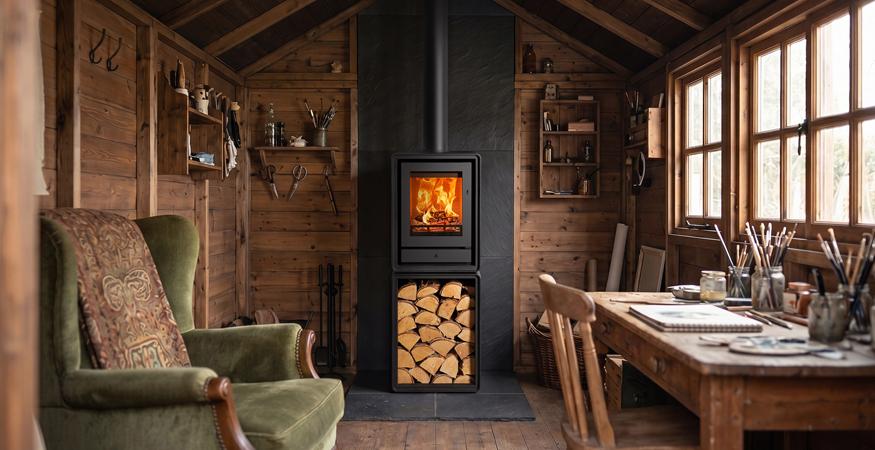 Stovax Riva2 40 Freestanding wood burning stove with log box in a shed or summerhouse