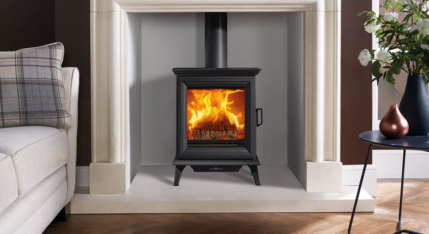 Stovax Sheraton 5 wood burning and multi-fuel stoves. Shown with Cavendish Bolection Limestone. 