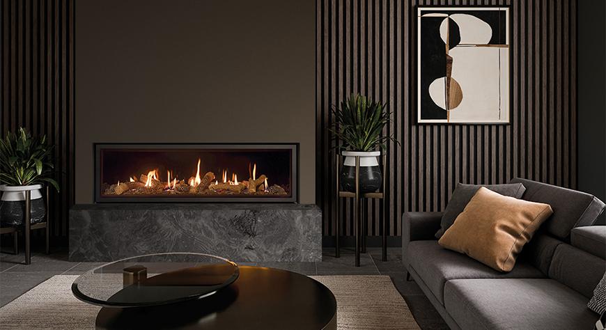 Studio 3, Edge ‘Cool Wall’ with Log-effect fuel bed and EchoFlame Black Glass Lining.