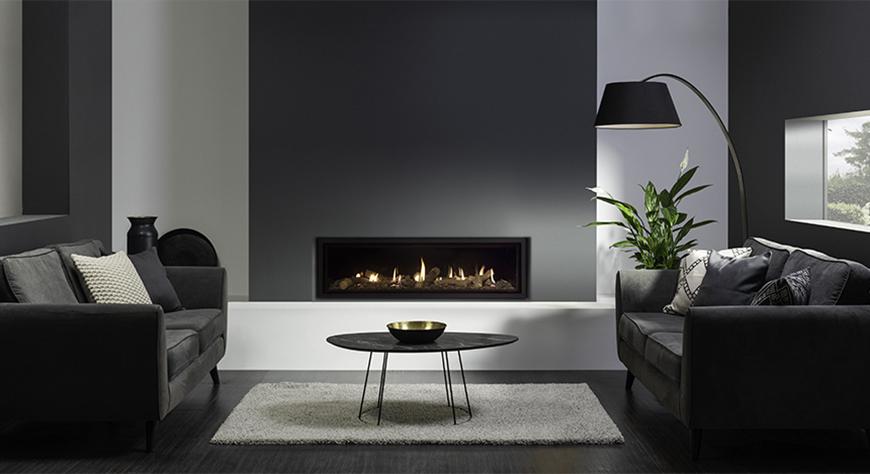 Studio 3, Edge ‘Cool Wall’ with Log-effect fuel bed and EchoFlame Black Glass Lining.